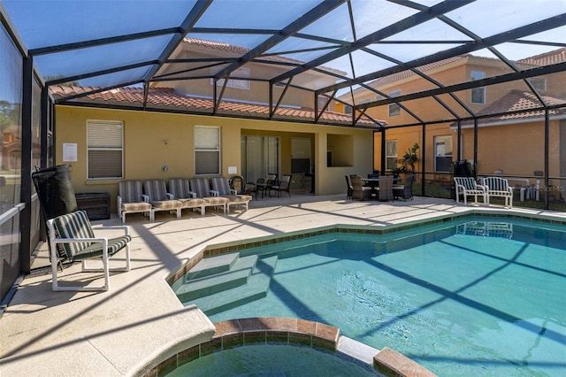113 Tiger Lily Ct, Davenport, FL 33837 - view of pool with a patio area, a pool with connected hot tub, outdoor dining space, and a lanai