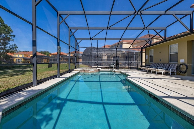 113 Tiger Lily Ct, Davenport, FL 33837 - view of swimming pool with a lawn, glass enclosure, a patio, a pool with connected hot tub, and a residential view