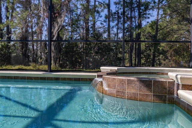 113 Tiger Lily Ct, Davenport, FL 33837 - view of swimming pool with glass enclosure and a pool with connected hot tub