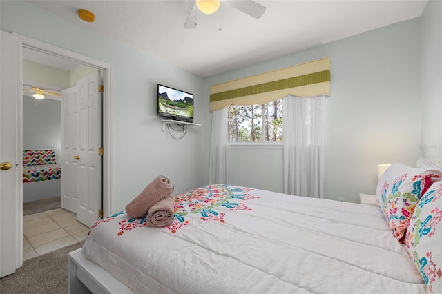 113 Tiger Lily Ct, Davenport, FL 33837 - tiled bedroom featuring carpet flooring and ceiling fan