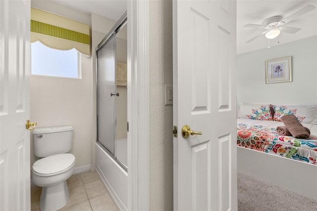 113 Tiger Lily Ct, Davenport, FL 33837 - ensuite bathroom featuring bath / shower combo with glass door, toilet, a ceiling fan, and tile patterned floors