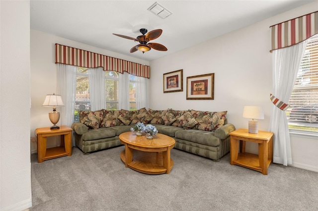 113 Tiger Lily Ct, Davenport, FL 33837 - carpeted living area with ceiling fan and baseboards
