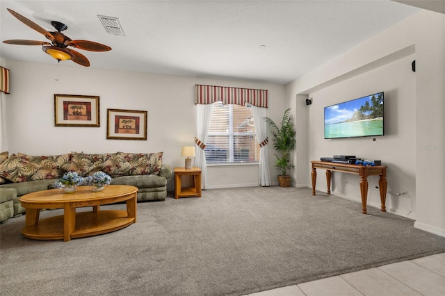 113 Tiger Lily Ct, Davenport, FL 33837 - carpeted living area with ceiling fan, baseboards, and tile patterned flooring