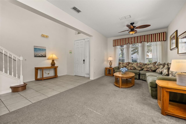 113 Tiger Lily Ct, Davenport, FL 33837 - carpeted living area featuring a ceiling fan, tile patterned floors, stairs, and baseboards