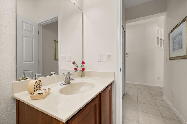 113 Tiger Lily Ct, Davenport, FL 33837 - bathroom with vanity, tile patterned flooring, and baseboards