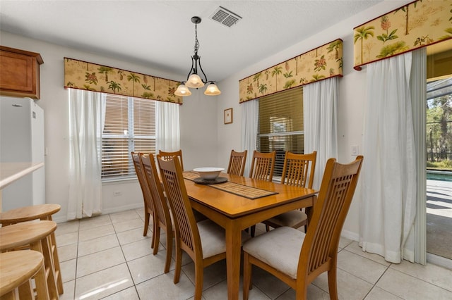 113 Tiger Lily Ct, Davenport, FL 33837 - dining room featuring light tile patterned floors and baseboards