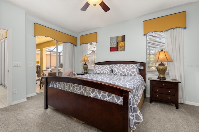 113 Tiger Lily Ct, Davenport, FL 33837 - carpeted bedroom featuring access to exterior, baseboards, and ceiling fan