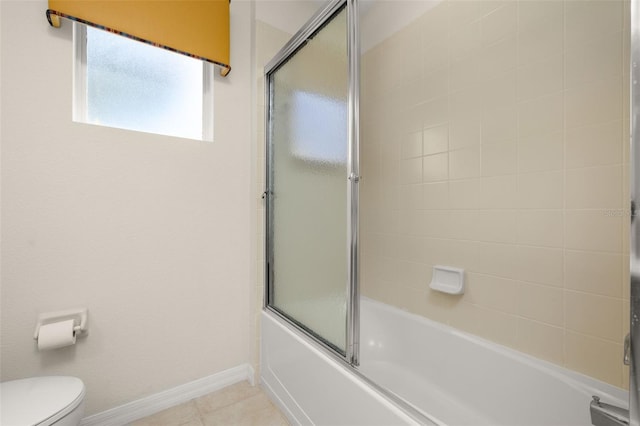 113 Tiger Lily Ct, Davenport, FL 33837 - bathroom featuring toilet, enclosed tub / shower combo, baseboards, and tile patterned flooring