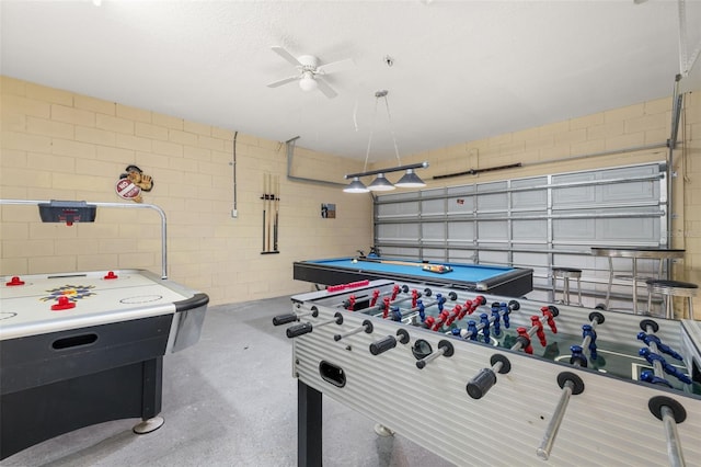 113 Tiger Lily Ct, Davenport, FL 33837 - playroom with ceiling fan, concrete floors, and a garage