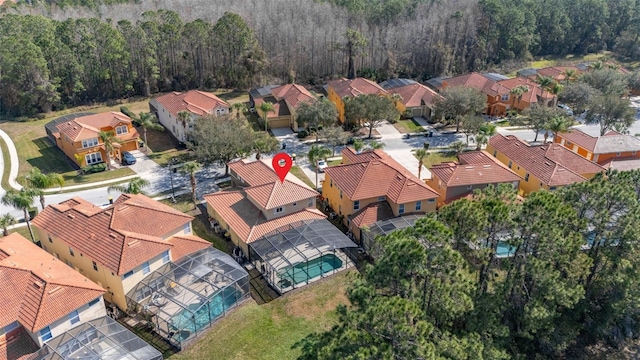 113 Tiger Lily Ct, Davenport, FL 33837 - aerial perspective of suburban area featuring a heavily wooded area