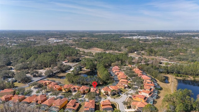 113 Tiger Lily Ct, Davenport, FL 33837 - aerial overview of property's location with a large body of water and nearby suburban area