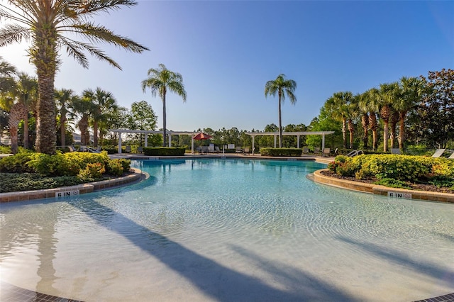 113 Tiger Lily Ct, Davenport, FL 33837 - community pool featuring a pergola