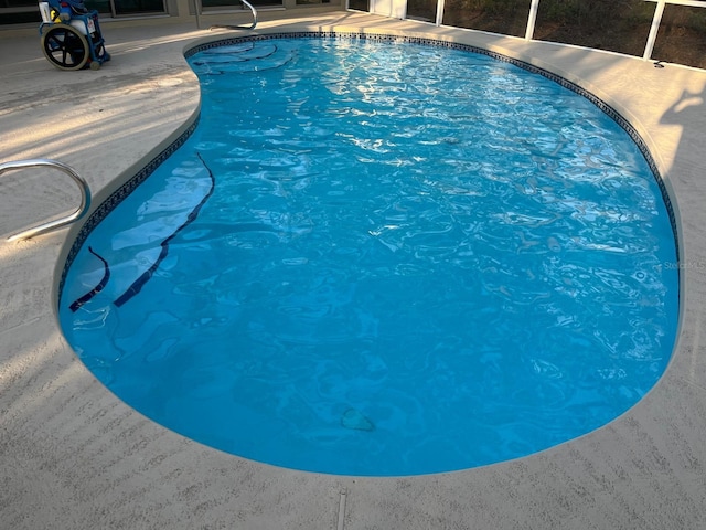 pool featuring glass enclosure