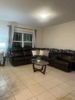 living room with light tile patterned floors