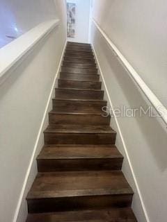 stairs with wood finished floors