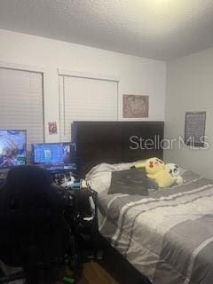 bedroom with wood finished floors