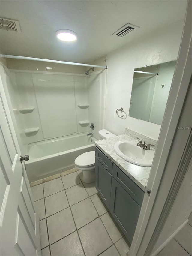 bathroom featuring toilet,  shower combination, visible vents, and tile patterned floors