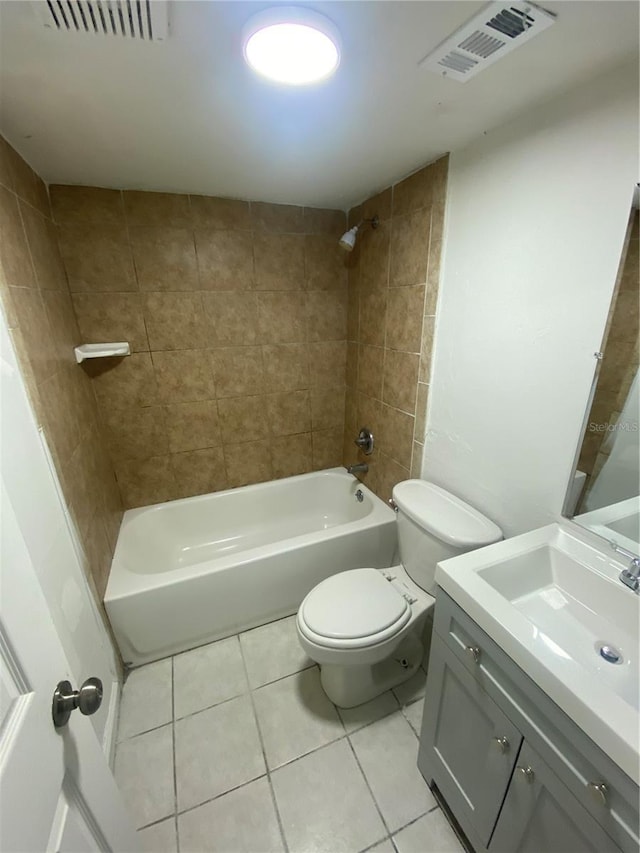 full bathroom with toilet, vanity, visible vents, and tile patterned floors