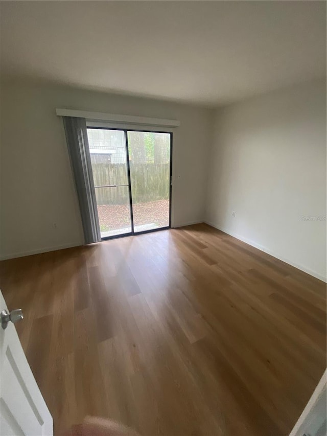 empty room featuring wood finished floors