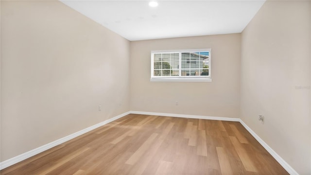 1695 Lee Rd Unit E103, Winter Park, FL 32789 - unfurnished room featuring baseboards, light wood-style flooring, and recessed lighting