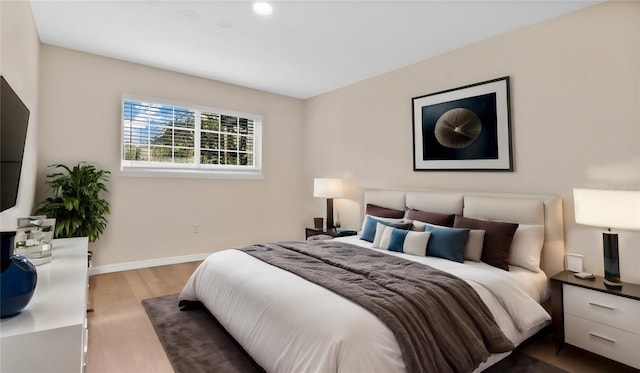 1695 Lee Rd Unit E103, Winter Park, FL 32789 - bedroom featuring wood finished floors and baseboards
