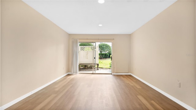 1695 Lee Rd Unit E103, Winter Park, FL 32789 - spare room featuring wood finished floors, baseboards, and recessed lighting