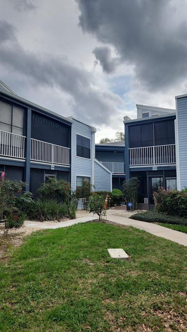 view of property's community with a lawn