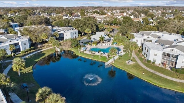 birds eye view of property with a water view and a residential view