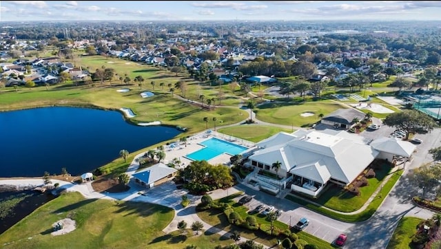 aerial view with a residential view, view of golf course, and a water view