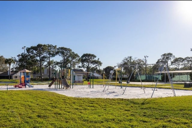 communal playground with a lawn