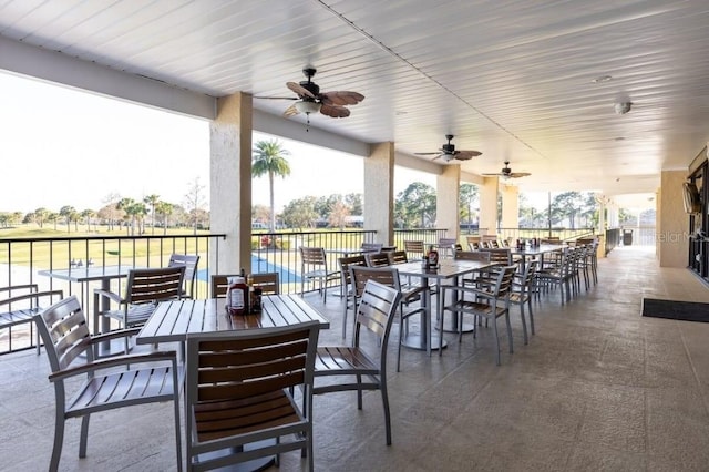 view of patio featuring a ceiling fan and outdoor dining area