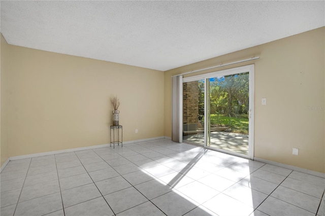 406 Oak Haven Dr Unit 406, Altamonte Springs, FL 32701 - unfurnished room featuring a textured ceiling, baseboards, and light tile patterned floors