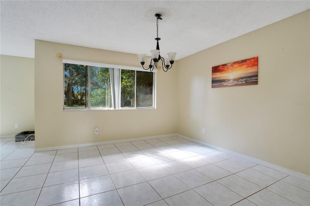 406 Oak Haven Dr Unit 406, Altamonte Springs, FL 32701 - unfurnished room with a textured ceiling, light tile patterned flooring, baseboards, and a notable chandelier