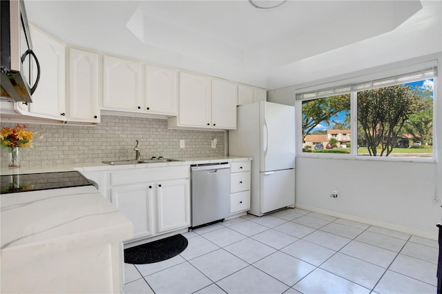406 Oak Haven Dr Unit 406, Altamonte Springs, FL 32701 - kitchen with white cabinets, tasteful backsplash, stainless steel appliances, and a sink