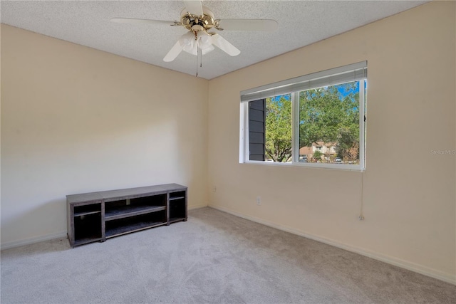 406 Oak Haven Dr Unit 406, Altamonte Springs, FL 32701 - unfurnished room featuring light carpet, a textured ceiling, a ceiling fan, and baseboards