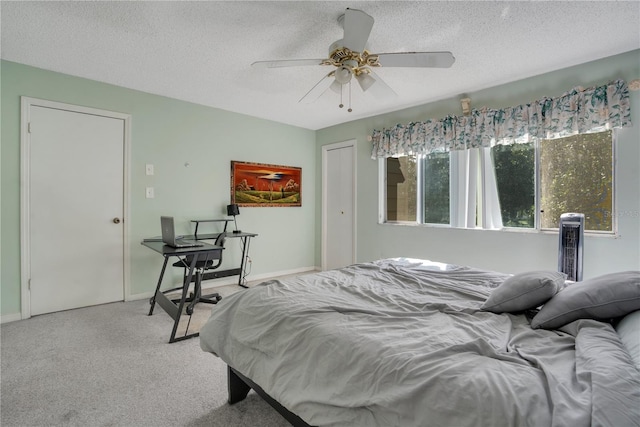 406 Oak Haven Dr Unit 406, Altamonte Springs, FL 32701 - bedroom with light carpet, a textured ceiling, a ceiling fan, and baseboards