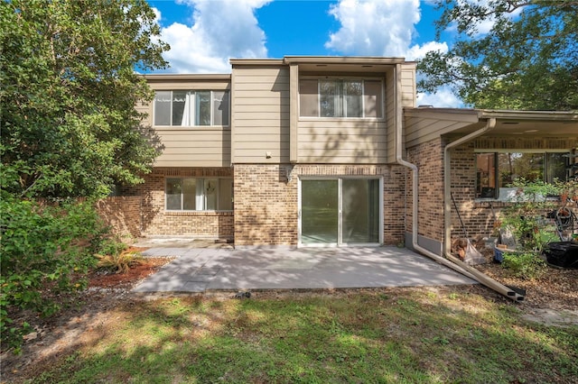 406 Oak Haven Dr Unit 406, Altamonte Springs, FL 32701 - rear view of property with a patio area and brick siding