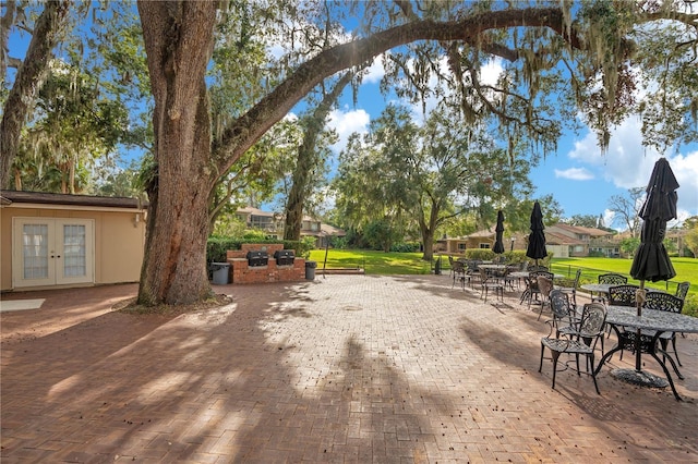406 Oak Haven Dr Unit 406, Altamonte Springs, FL 32701 - exterior space featuring exterior kitchen, a lawn, a patio area, and outdoor dining space
