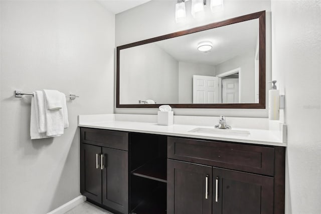 bathroom featuring vanity and baseboards