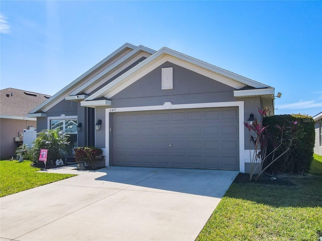 ranch-style home featuring concrete driveway, a front lawn, an attached garage, and stucco siding