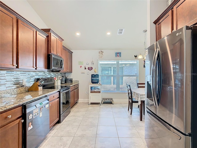 649 Meadow Pointe Dr, Haines City, FL 33844 - kitchen featuring visible vents, light stone countertops, decorative backsplash, appliances with stainless steel finishes, and light tile patterned flooring