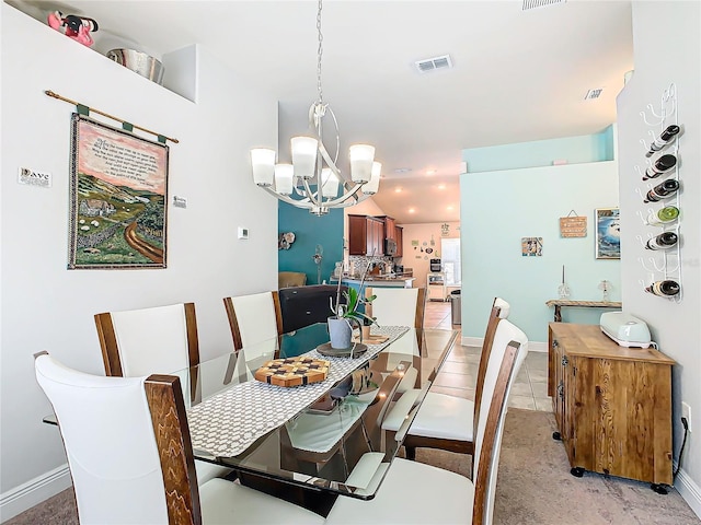 649 Meadow Pointe Dr, Haines City, FL 33844 - dining space with visible vents, a chandelier, and vaulted ceiling