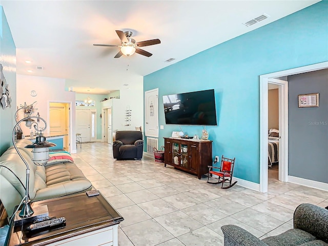 649 Meadow Pointe Dr, Haines City, FL 33844 - living room with light tile patterned floors, visible vents, and ceiling fan