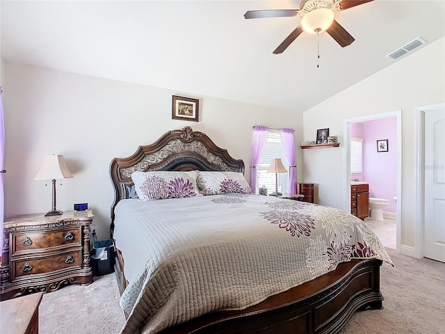 649 Meadow Pointe Dr, Haines City, FL 33844 - bedroom with visible vents, a ceiling fan, connected bathroom, carpet flooring, and vaulted ceiling