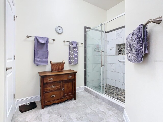 649 Meadow Pointe Dr, Haines City, FL 33844 - bathroom with baseboards and a stall shower