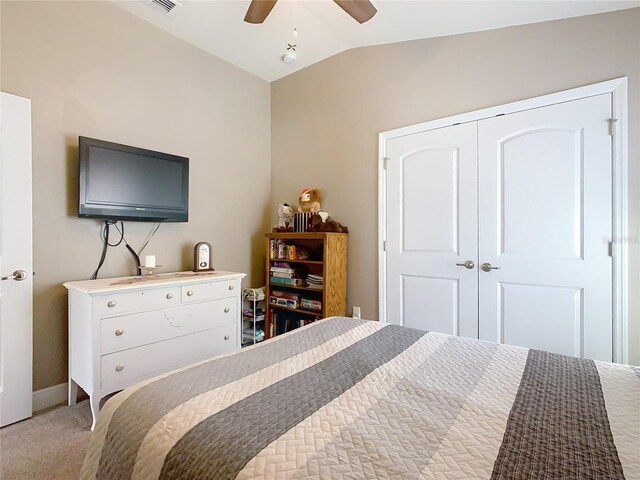 649 Meadow Pointe Dr, Haines City, FL 33844 - bedroom with visible vents, ceiling fan, vaulted ceiling, a closet, and light carpet