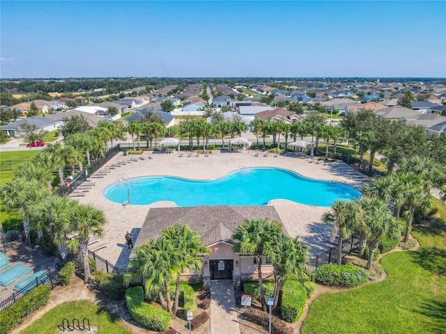 649 Meadow Pointe Dr, Haines City, FL 33844 - pool featuring a patio area, a residential view, and fence