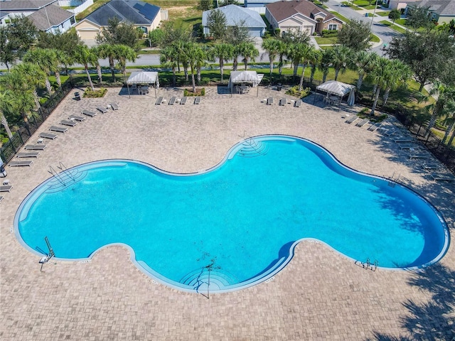 649 Meadow Pointe Dr, Haines City, FL 33844 - community pool with a gazebo, a residential view, and a patio