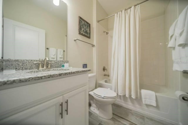 1646 Moon Valley Dr, Davenport, FL 33896 - bathroom with vanity, toilet, and shower / bathtub combination with curtain