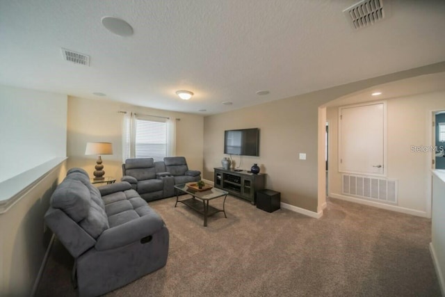 1646 Moon Valley Dr, Davenport, FL 33896 - living area featuring carpet floors, visible vents, and baseboards